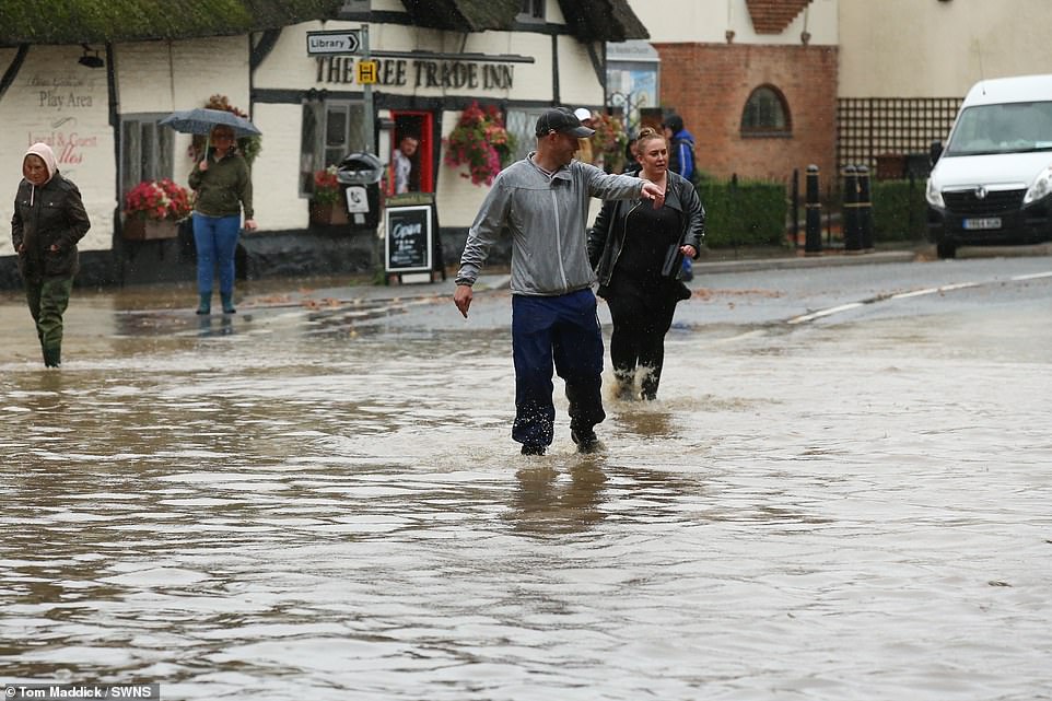 Deep floodwater has deluged the town of Sileby in Leicestershire today as locals survey the scene