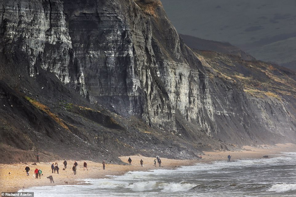 High winds, torrential rain and big seas with huge tides have made the cliffs dangerous at Charmouth in Dorset today