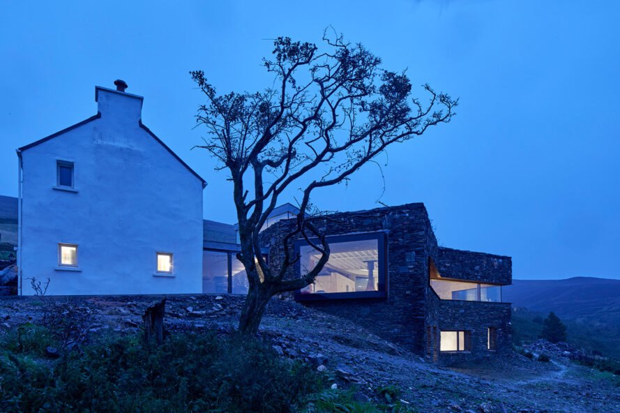 stone home on a hillside at dusk
